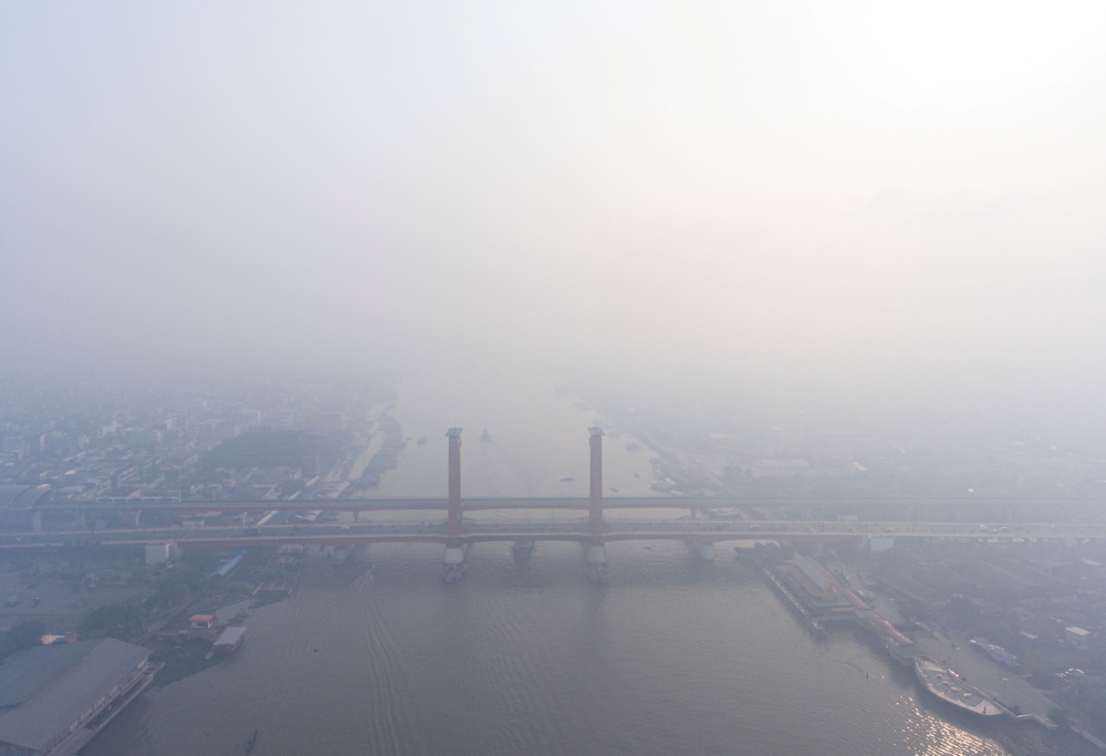 A view shows the Ampera bridge covered with smog due to wildfires in Palembang, South Sumatra province, Indonesia, October 1, 2023. — Antara Foto/Nova Wahyudi handout pic via Reuters 