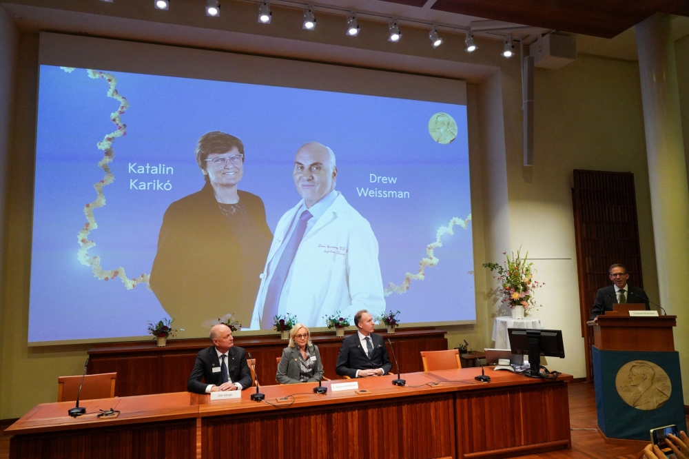 Thomas Perlmann, secretary of the Karolinska Institute Nobel Committee and Nobel Assembly, announces Katalin Kariko and Drew Weissman as laureates of this year's Nobel Prize in Medicine during a press conference, in Stockholm October 2, 2023. — Reuters pic