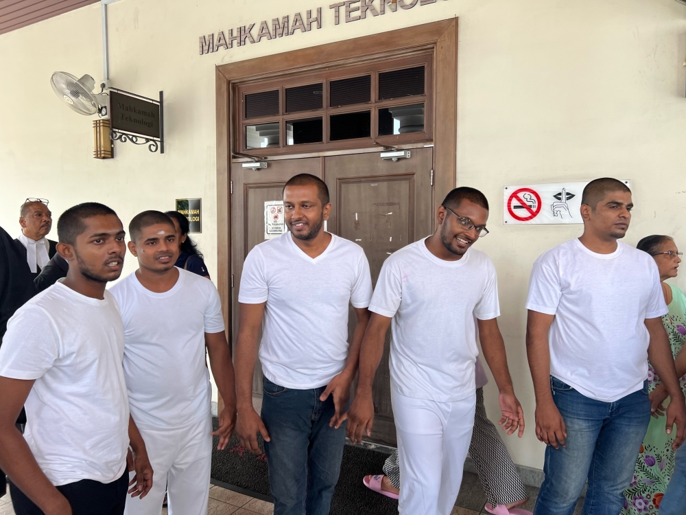 The five men (from left) K. Tatisan, V. Sharmah, S. Gopinaath, S. Gokulan and J. Ragesuthan were acquitted and released today. — Picture by Opalyn Mok 