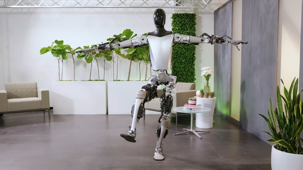 After working hard, Optimus can kick back and relax with some yoga moves. — Picture courtesy of Tesla via ETX Studio