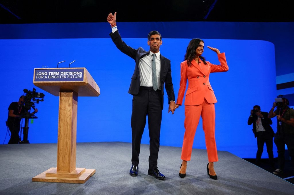 British Prime Minister Rishi Sunak and his wife Akshata Murty greet people on stage, at Britain's Conservative Party's annual conference in Manchester, Britain, October 4, 2023. — Reuters pic