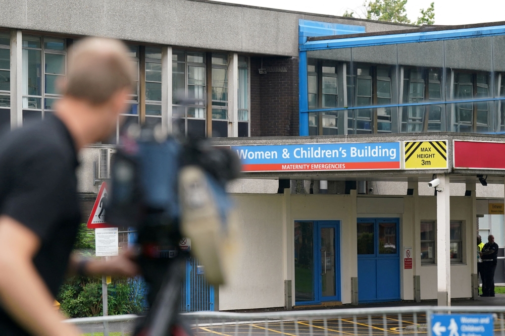 Members of the media outside the Countess of Chester Hospital in August this year. — Reuters pic