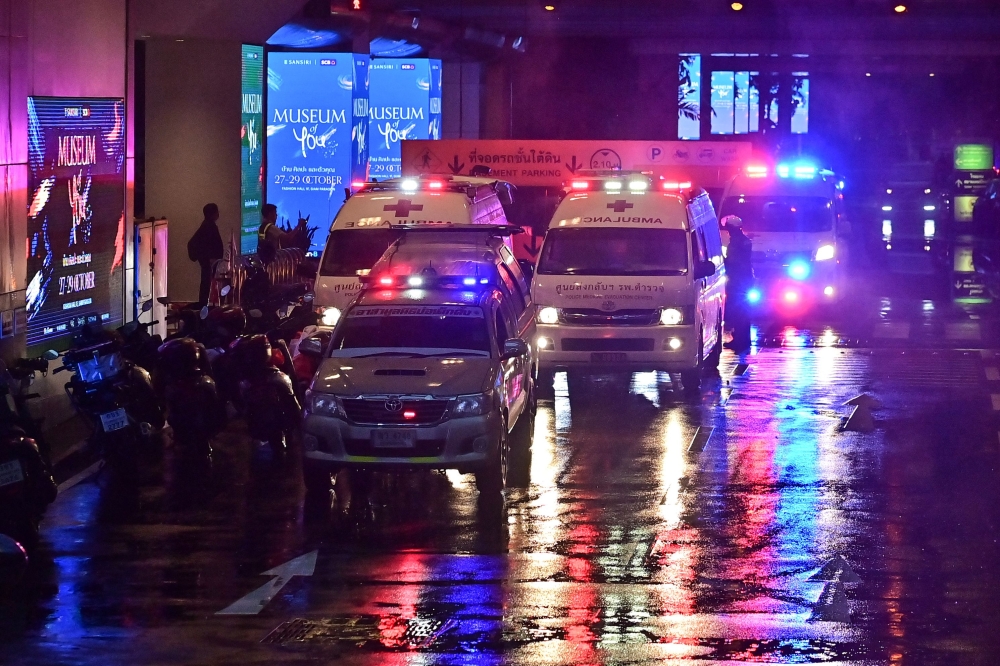 Thai police today arrested two men accused of selling a gun to a 14-year-old suspected of carrying out a shooting attack at a Bangkok mall that left two people dead. — AFP pic