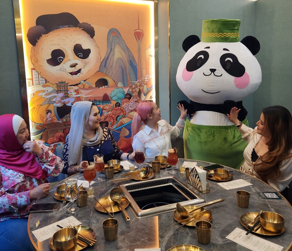 The restaurant entertains customers with a panda mascot dressed in traditional Malay attire. — Picture courtesy of Supamala