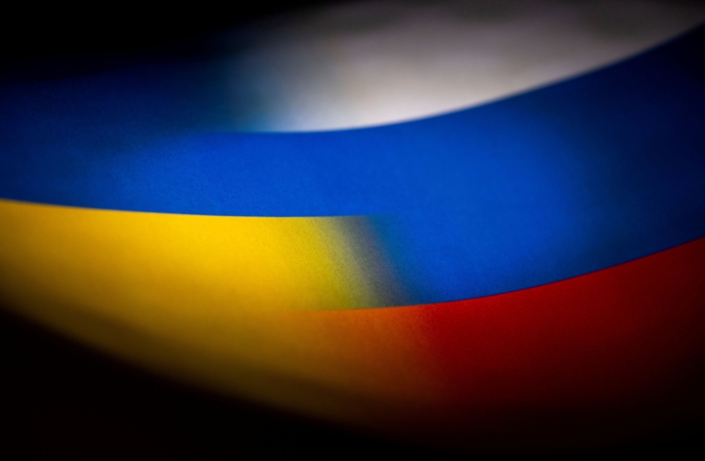 Russia's and Ukraine's flags are seen printed on paper in this illustration taken January 27, 2022. — Reuters pic