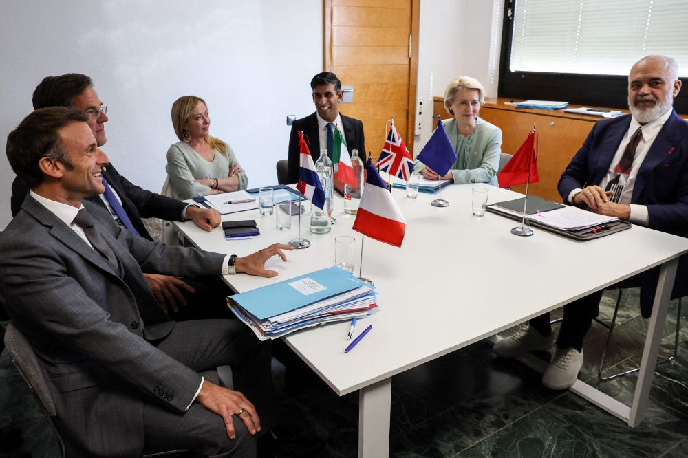 (From left) French President Emmanuel Macron, Netherland’s Prime Minister Mark Rutte, Italian Prime Minister Giorgia Meloni, British Prime Minister Rishi Sunak, President of the European Commission Ursula von der Leyen and Albanian Prime Minister Edi Rama take part in a meeting during the European Political Community summit at the Palacio de Congreso in Granada, southern Spain on October 5, 2023. 