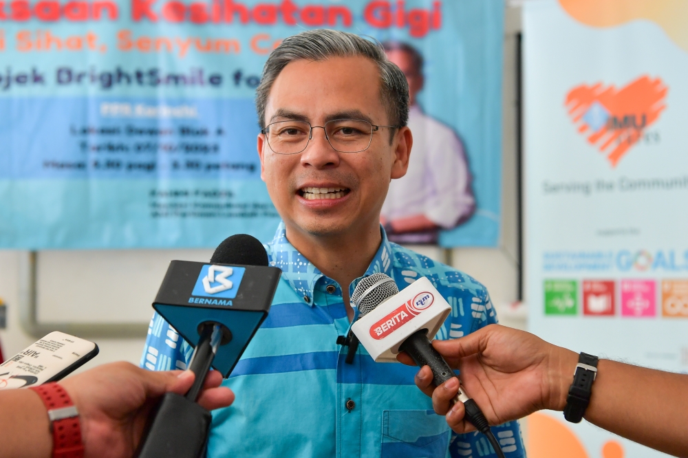 Communications and Digital Minister and Lembah Pantai MP Fahmi Fadzil speaks to the media after attending the ‘Pemeriksaan Kesihatan Gigi: Gigi Sihat Senyum Ceria’ at the People’s Housing Project in Kerinchi October 7, 2023. — Bernama pic