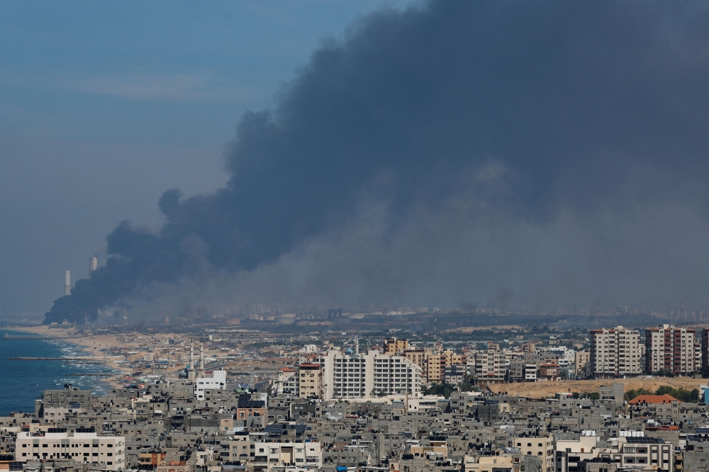 Smoke rises from the Israeli side after Palestinian Hamas gunmen infiltrated areas of southern Israel, as seen from Gaza, October 7, 2023. — Reuters pic