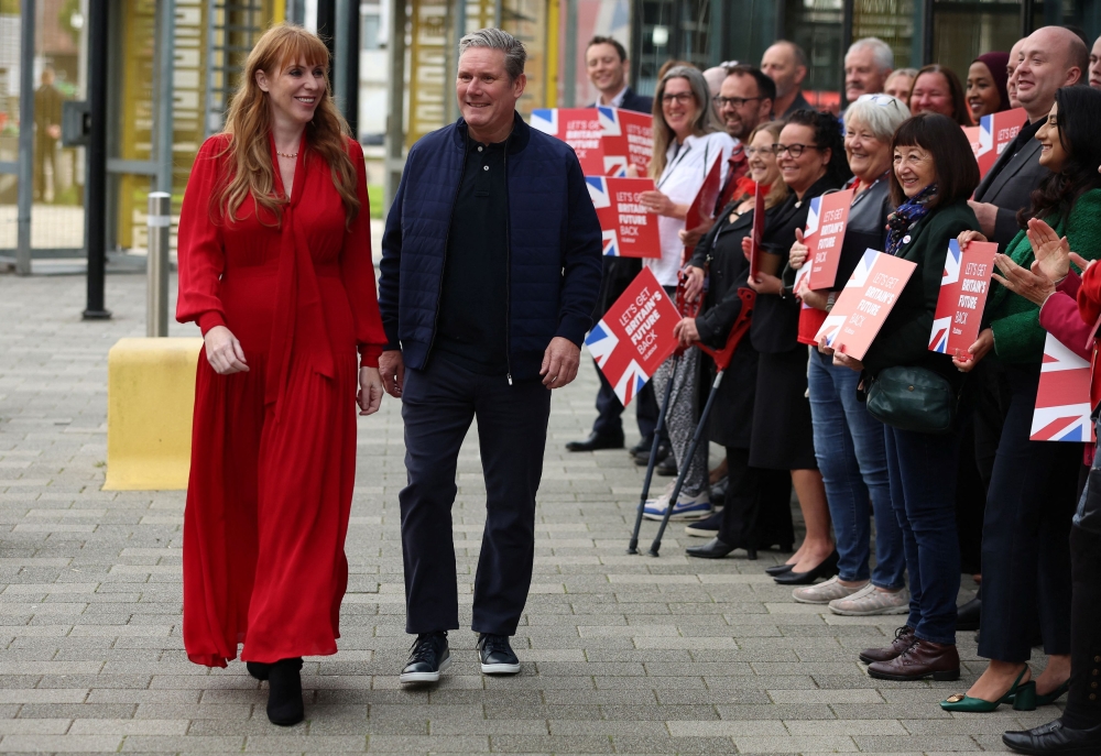 Britain’s Labour Party Leader Keir Starmer arrives with his deputy Angela Rayner ahead of the start of, Britain’s Labour Party annual conference in Liverpool, Britain, October 7, 2023. — Reuters pic