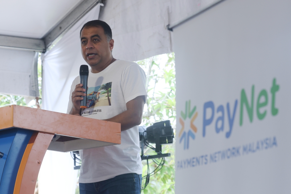 PayNet Group Chief Executive Officer Farhan Ahmad delivering his speech at the launch of the Cashless Langkawi Campaign at Laman Padi October 7, 2023. — Bernama pic