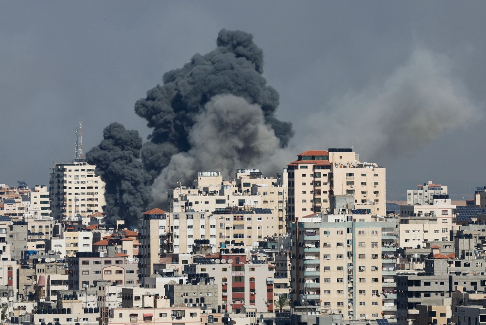 Smoke rises following Israeli strikes in Gaza, October 7, 2023. — Reuters pic