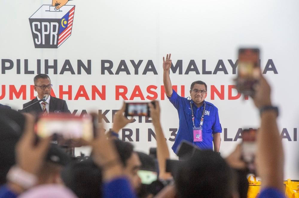 Newly-elected Pelangai member of Pahang state assembly Amizar Abu Adam reacts during announcement of the Pelangai by-election result at Dewan Orang Ramai Felda Kemasol in Bentong October 7, 2023. — Picture by Shafwan Zaidon