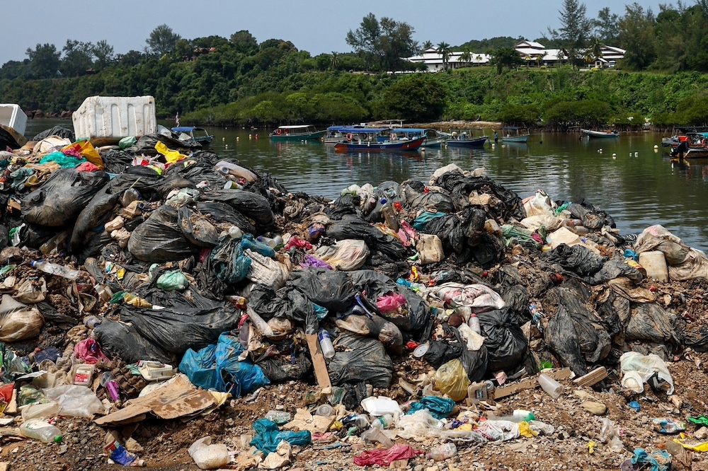 The pile of uncollected garbage near the fishermen’s jetty in Kampung Baru Pulau Redang. — Bernama pic