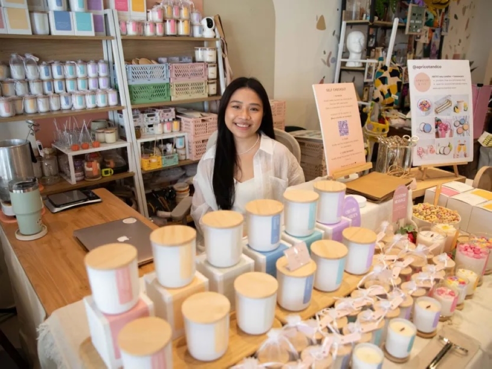 Samantha Fong who runs soy candle business Apricot and Co at Curbside Crafters on Oct 6, 2023. — TODAY pic