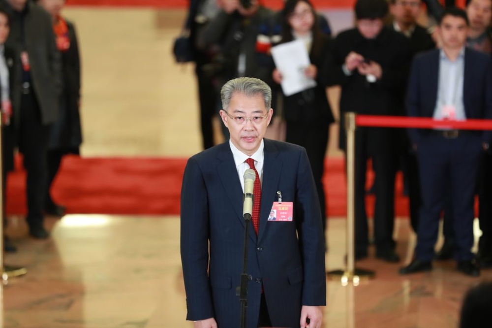 Li Xiaopeng, Chairman of China Everbright Group Ltd., is interviewed as he arrives at the ‘delegate passage’ before the closing meeting for the second session of the 13th National Committee of the CPPCC (Chinese People’s Political Consultative Conference) in Beijing, China, March 13, 2018. — Reuters pic