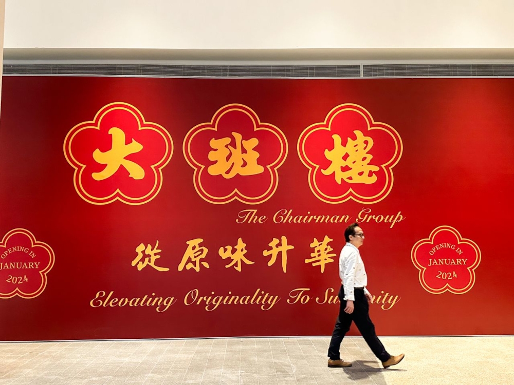 The hoarding for The Chairman Group was spotted in Pavilion Damansara Heights Mall announcing their opening in January 2024. — Picture by Lee Khang Yi