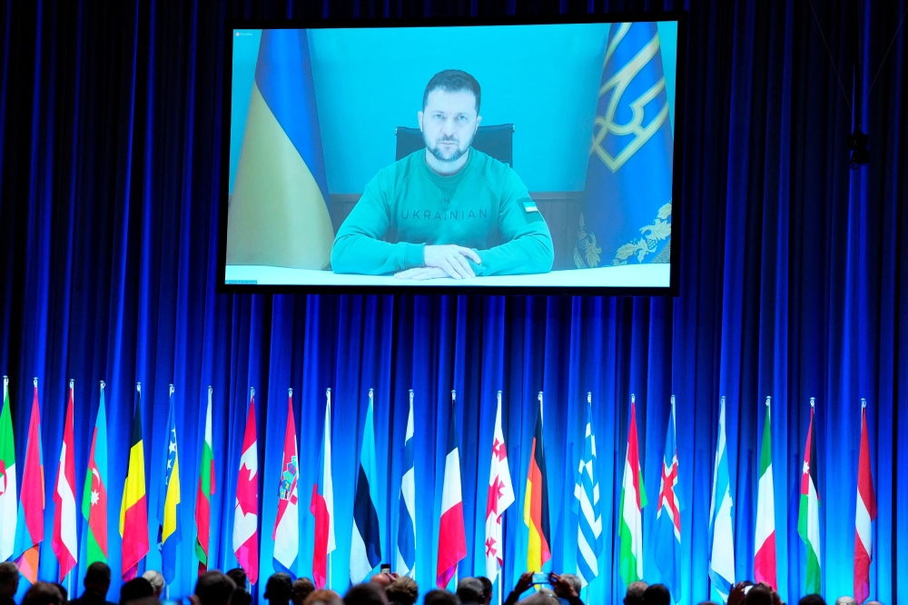 President of Ukraine, Volodymyr Zelenskiy is seen speaking via video conference at the Nato Parliamentary Assembly in Copenhagen, Denmar  October 9, 2023.  — Ritzau Scanpix/Liselotte Sabroe via Reuters