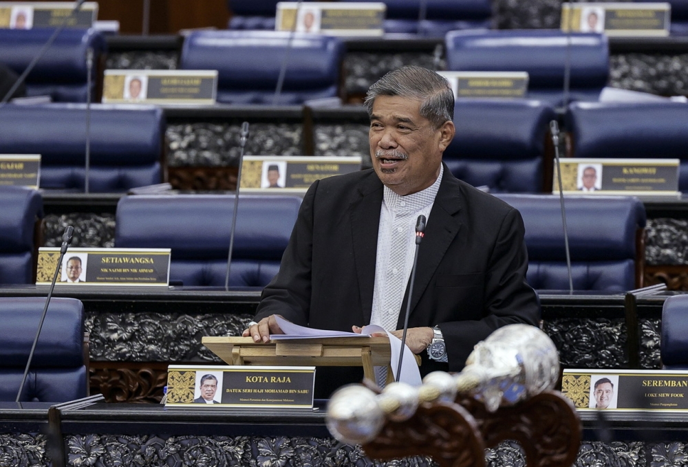 Minister of Agriculture and Food Security Datuk Seri Mohamad Sabu speaking during the minister's information session on the rice issue at the Dewan Rakyat meeting in Parliament, October 9, 2023. — Bernama pic