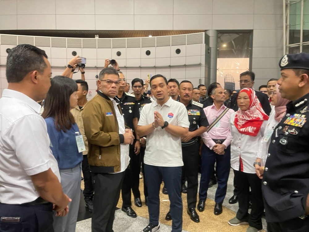 Home Affairs Minister Datuk Seri Saifuddin Nasution Ismail and Johor Menteri Besar Datuk Onn Hafiz Ghazi inspect the Customs, Immigration and Quarantine Complex in Johor Baru October 11, 2023 — Picture by Ben Tan