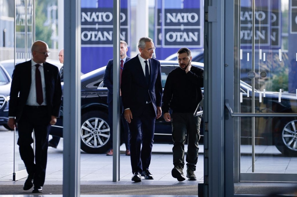 Ukrainian President Volodymyr Zelenskiy and Secretary General of Nato Jens Stoltenberg walk on the day of a Nato Defence Ministers' meeting at the Alliance's headquarters in Brussels, Belgium October 11, 2023. — Reuters pic