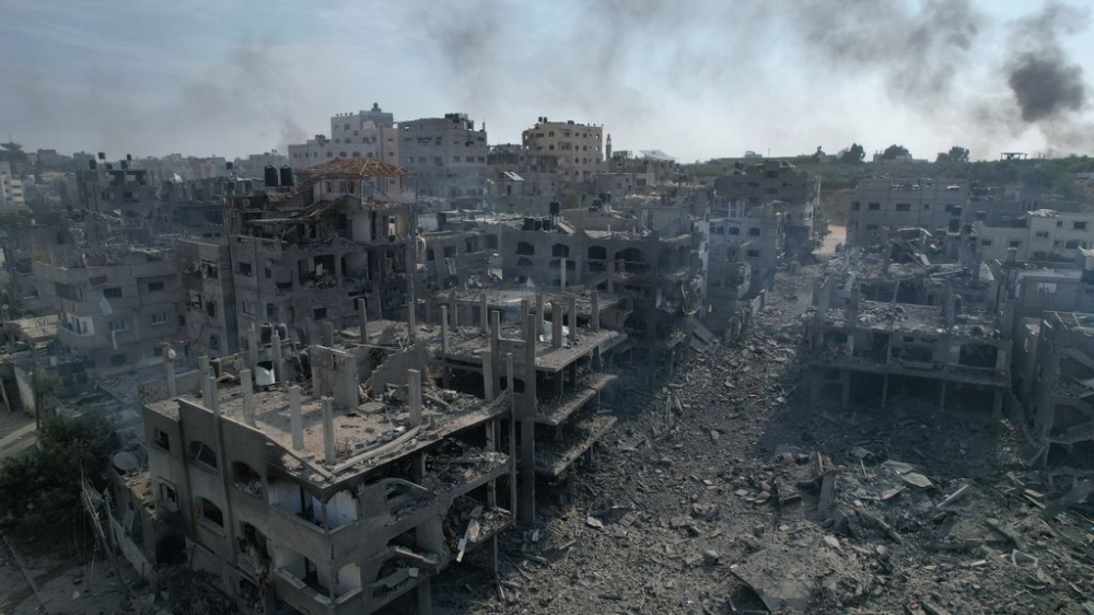 An aerial view of destroyed buildings and debris at the Jabalia neighborhood after the Israeli airstrikes that has been going on for five days in Gaza City, Gaza on October 11, 2023. — Stringer / AnadoluNo via Reuters