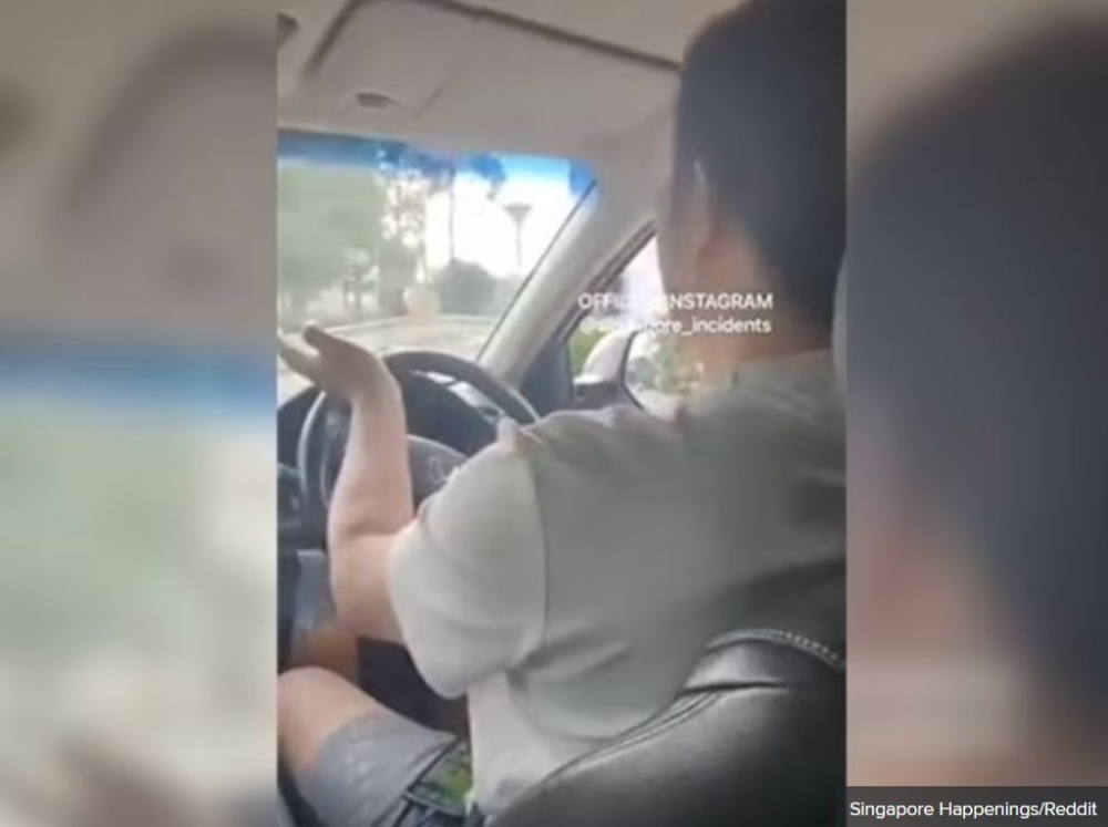 A screenshot of a video clip posted on online forum Reddit showing a driver having an argument with his passenger. — Singapore Happenings/Reddit via TODAY