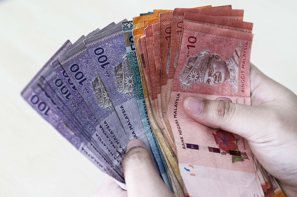 Ringgit opens lower against US dollar amid cautious sentiment | Malay Mail