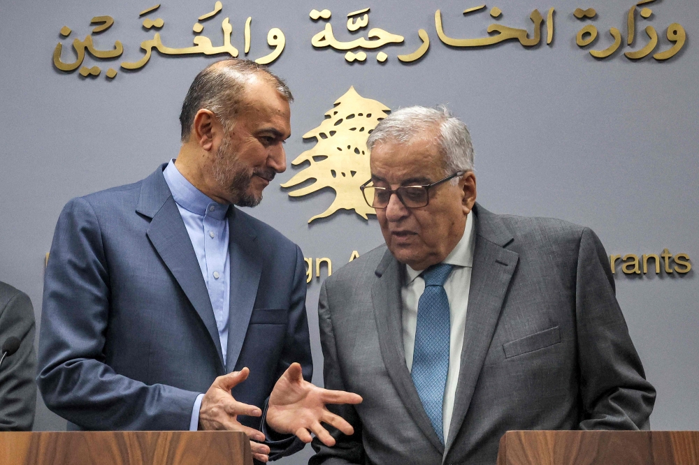 Iran’s Foreign Minister Hossein Amir-Abdollahian (L) and Lebanese Foreign Minister Abdallah Bouhabib at a joint press conference in Beirut today. — AFP pic