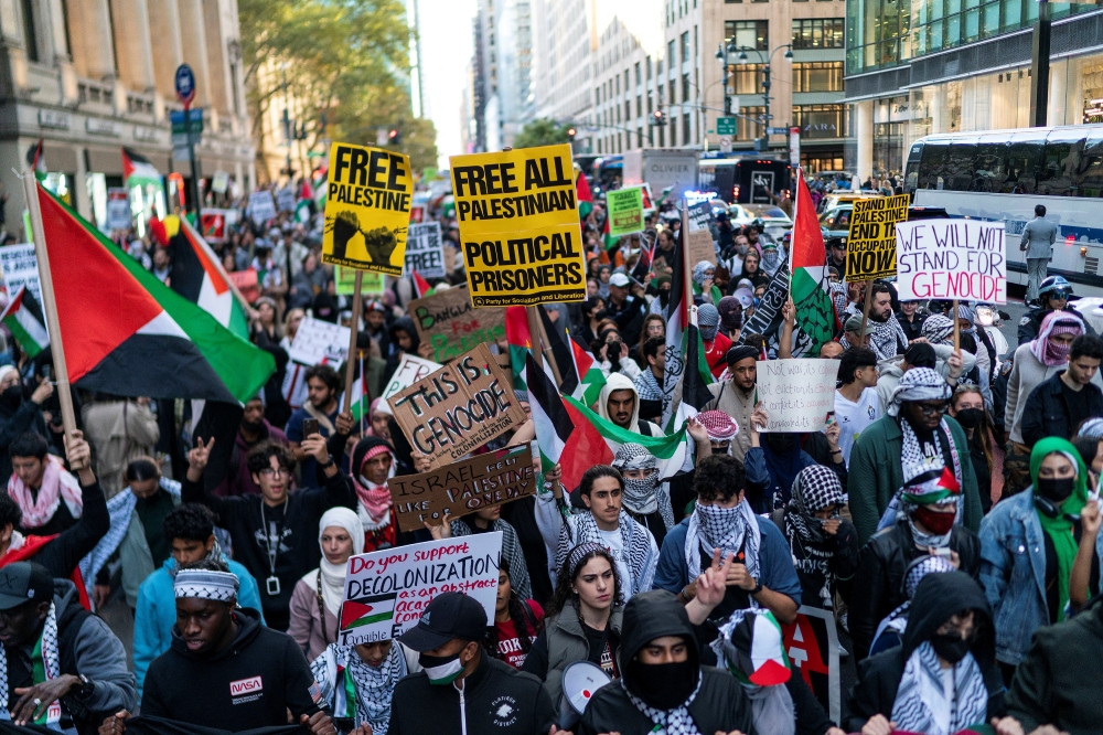 People march during a demonstration to express solidarity with Palestinians in Gaza, amid the ongoing conflict between Israel and the Palestinian Islamist group Hamas, in New York October 13, 2023. ― Reuters pic
