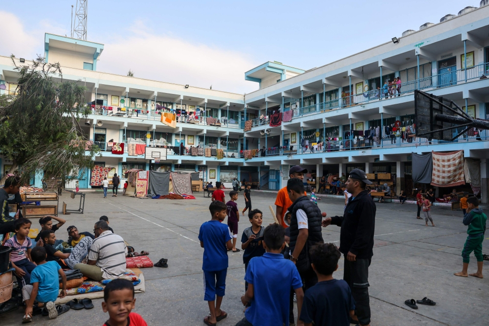 Internally displaced Palestinians take refuge in a United Nations school, in the Rafah refugee camp, in the southern of Gaza Strip on October 14, 2023, as fighting between Israel and the Hamas movement continues for the eighth consecutive day in the Gaza Strip enclave. — AFP pic