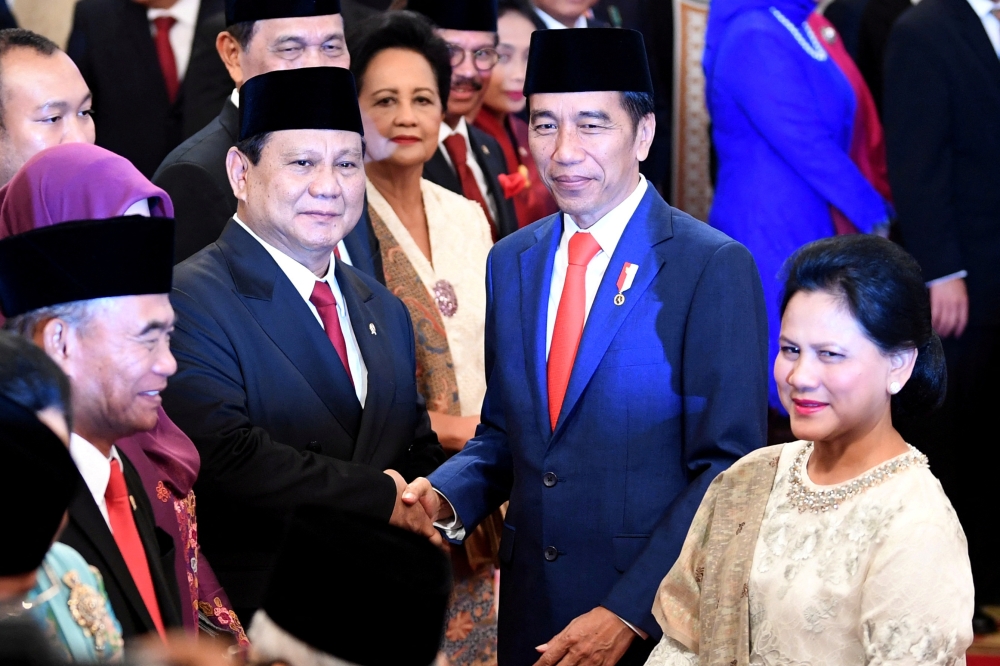 File photo of Indonesian Defense Minister Prabowo Subianto is congratulated by Indonesian President Joko Widodo, as First Lady Iriana Widodo stands next to them, after the swearing-in ceremony during the inauguration at the Presidential Palace in Jakarta, Indonesia, October 23, 2019 in this photo taken by Antara Foto. — Reuters pic