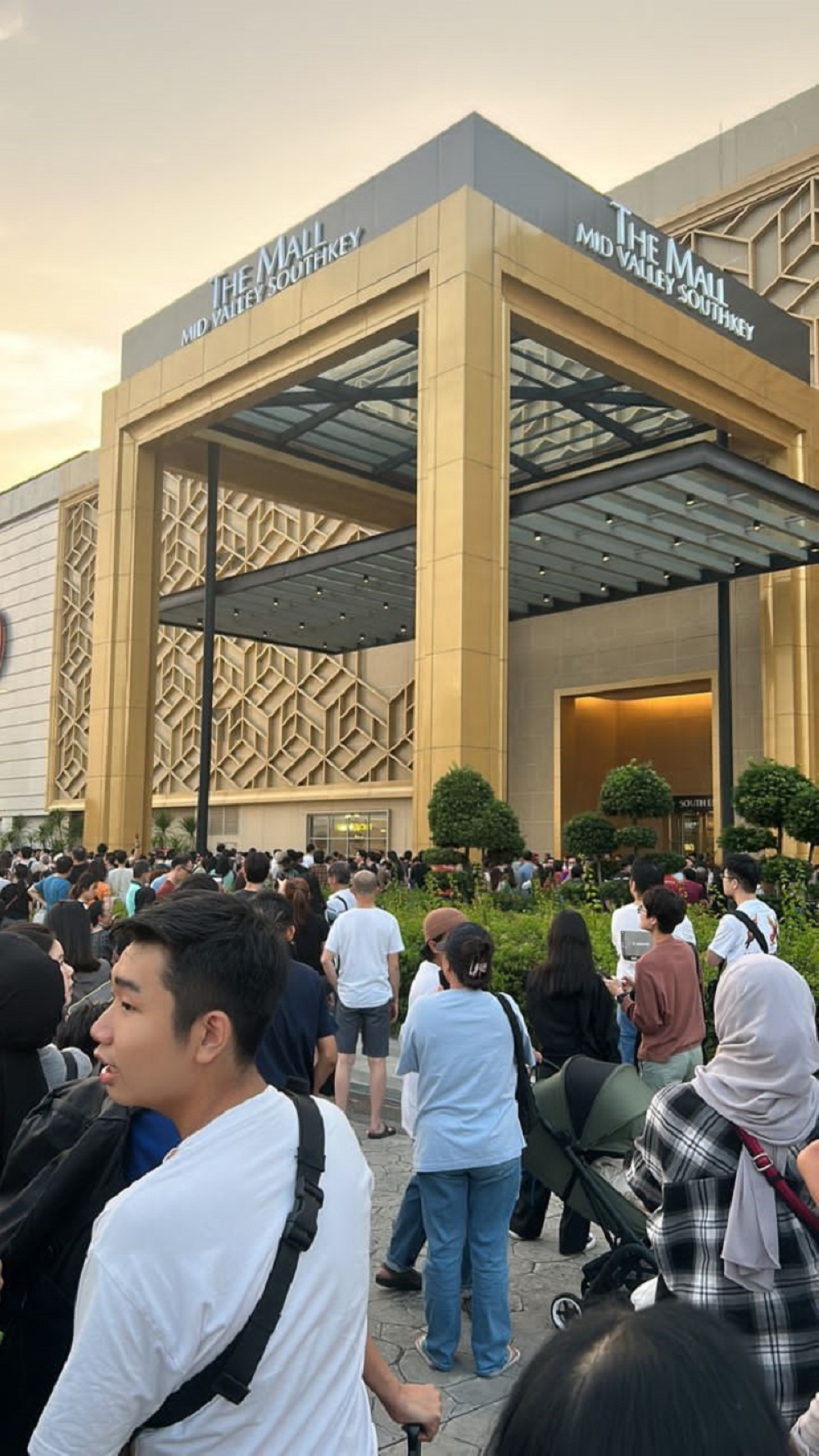 People are seen outside the Mid Valley Southkey shopping centre entrance in Johor Baru after the evacuation. — Picture courtesy of Balbeer Singh Jessy