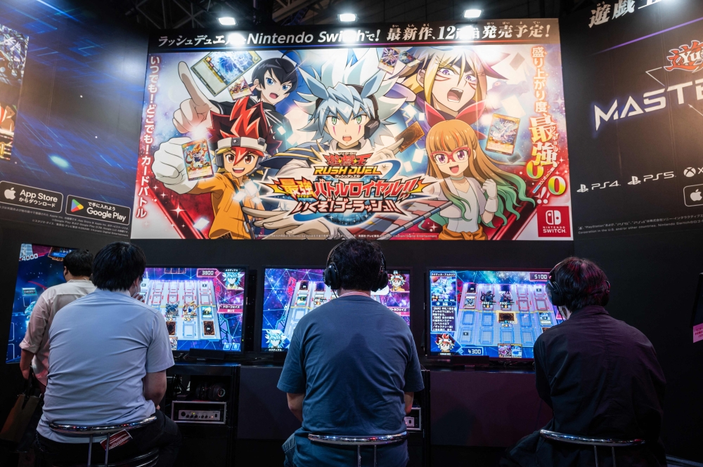 In this file photo taken on September 15, 2022, visitors play video games at the Tokyo Game Show. — AFP pic