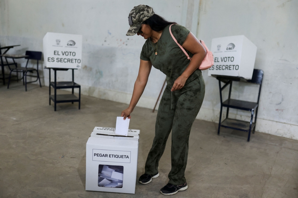 A person votes at a polling station during the presidential election, in Canuto, Ecuador October 15, 2023. — Reuters pic