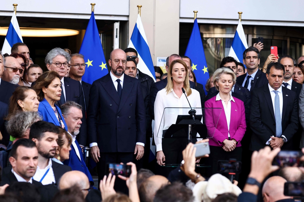 European Council President Charles Michel (centre, left), European Parliament President Roberta Metsola (centre) and European Commission President Ursula Von der Leyen (centre, right) take part in a tribute to the victims of the Hamas-organized attacks in Israel. — AFP pic