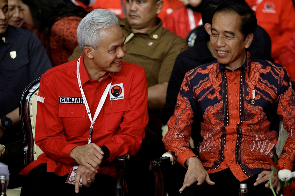 Ganjar Pranowo, Indonesia Democratic Party of Struggle (PDIP) candidate in the 2024 presidential election with Indonesian President Joko Widodo the party’s national meeting in Jakarta. — Reuters pic