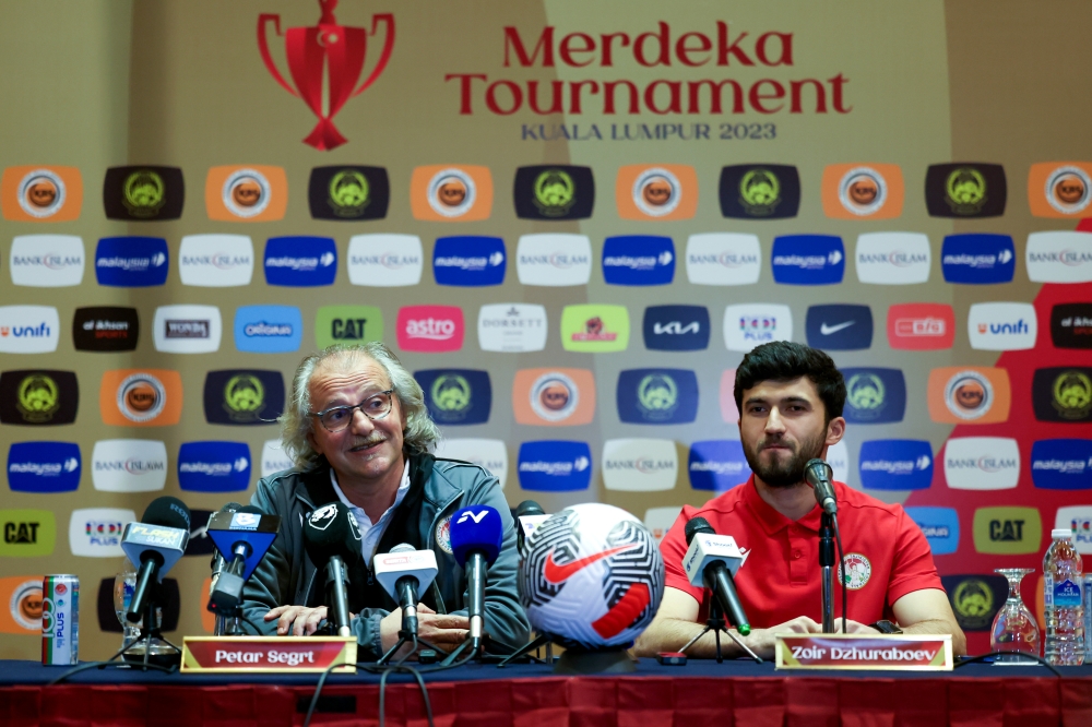 Tajikistan national coach Petar Segrt (left) and team captain Zoir Dzhuraboev (right) are seen during a pre-match press conference of the Merdeka Tournament 2023 final in Subang October 16, 2023. — Bernama pic