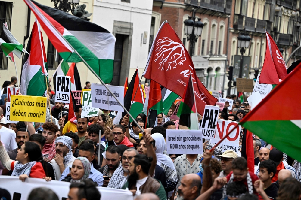 Demonstrators attend a rally in support of the Palestinian people in Madrid. — AFP pic