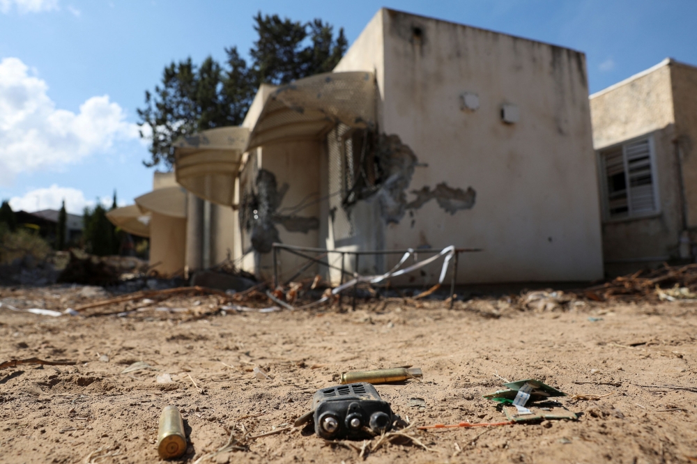 A view of casings and a broken electronic device, following a deadly infiltration by Hamas gunmen from the Gaza Strip, in Kibbutz Kfar Aza, southern Israel, October 18, 2023. — Reuters pic