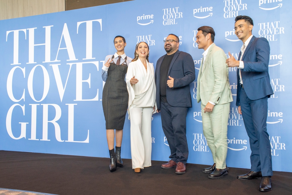 The cast of Prime Video's Amazon Original Series, ‘That Cover Girl’ with director Abid Hussain (centre) at the series premiere in KL. — Picture by Shafwan Zaidon