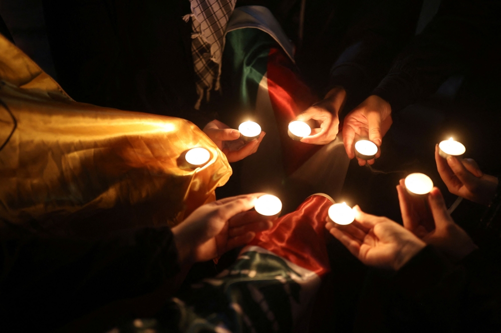 Supporters of Palestine light candles during a gathering in support of Palestinians, in Tehran, Iran, October 17, 2023. —  Wana News Agency pic via Reuters