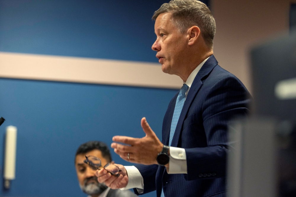 Attorney Brian Rafferty, who is representing defendant Sidney Powell, speaks to Fulton County Superior Judge Scott McAfee during a jury questionnaire hearing at the Fulton County Courthouse on October 16, 2023 in Atlanta, Georgia. — Pool via REUTERS