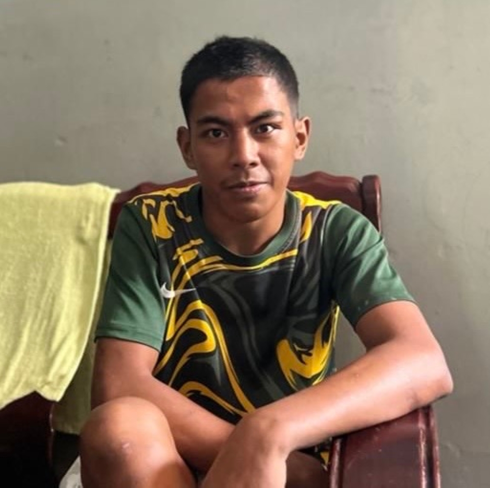 The body of Salman Syah, 25, was found in an oil palm plantation near his family house in Felda Sungai Tiram in Johor Baru on Tuesday. — Picture courtesy of Syarifah Masnan