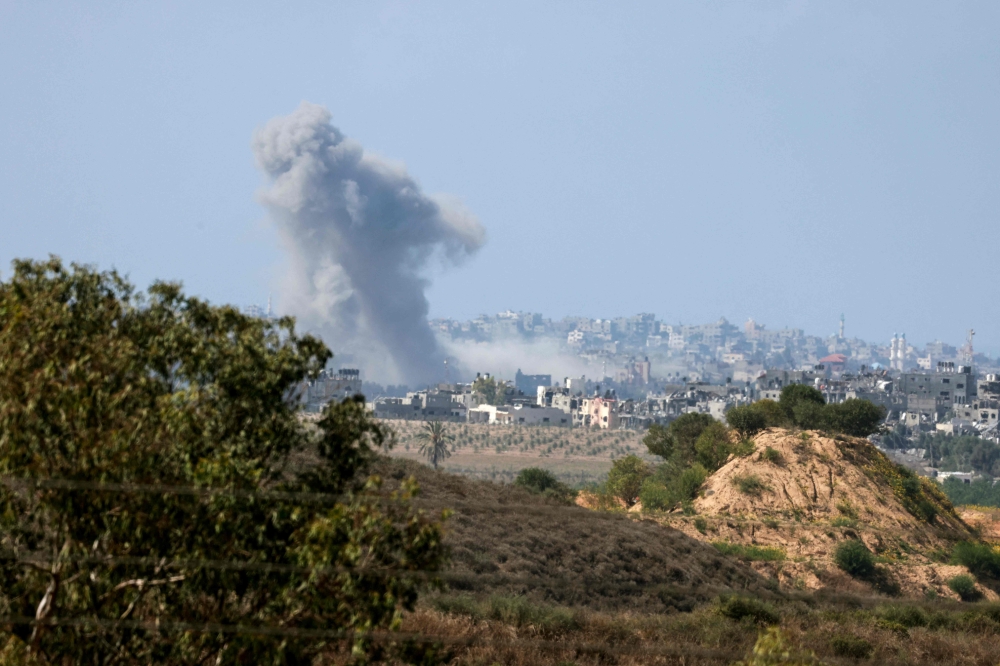 A picture taken from the southern Israeli city of Sderot on October 20, 2023, shows smoke ascending over the northern Gaza Strip following Israeli military strikes, amid the ongoing battles between Israel and the Palestinian group Hamas. — AFP pic
