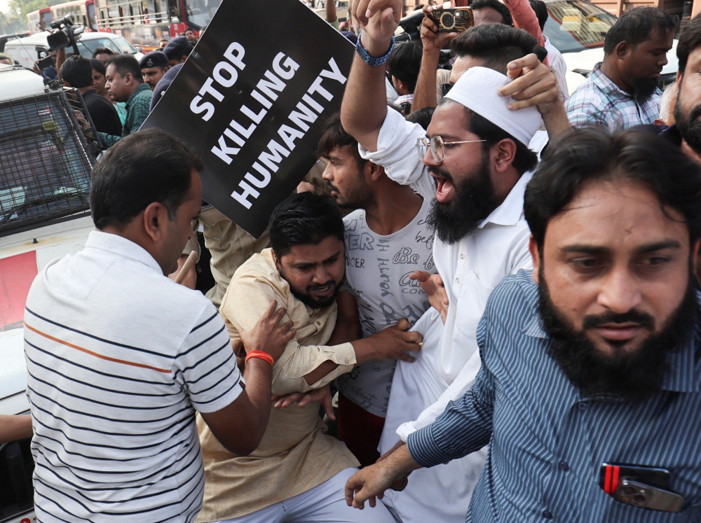 Police detain a person at a protest organised by different Muslim organisations in support of Palestinians in Gaza, as the conflict between Israel and Hamas continues, outside mosque in Ahmedabad October 20, 2023. — Reuters pic