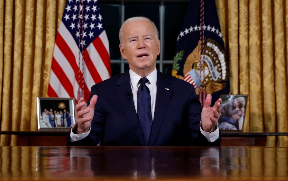 US President Joe Biden delivers a prime-time address to the nation about his approaches to the conflict between Israel and Hamas, humanitarian assistance in Gaza and continued support for Ukraine in their war with Russia, from the Oval Office of the White House in Washington October 19, 2023. — Reuters pic