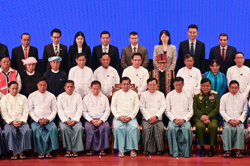 File photo of Myanmar’s junta chief Min Aung Hlaing (centre) posing for photo with other parties leaders and diplomats during a ceremony to mark the 8th anniversary of the Nationwide Ceasefire Agreement (NCA) in Naypyidaw on October 15, 2023. — AFP pic