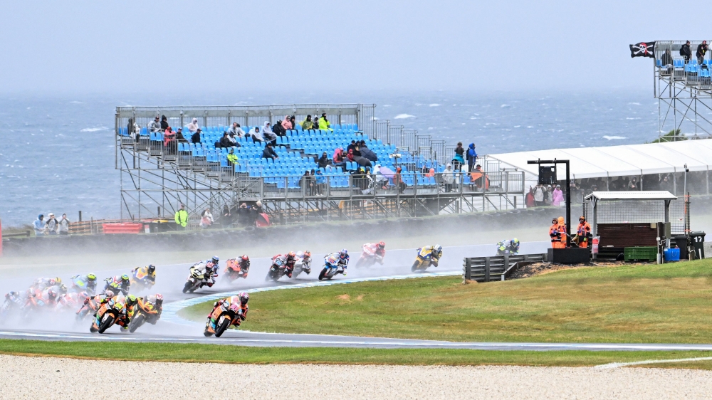 Riders race through the rain during the Moto2 race at the MotoGP Australian Grand Prix in Phillip Island on October 22, 2023. — AFP pic