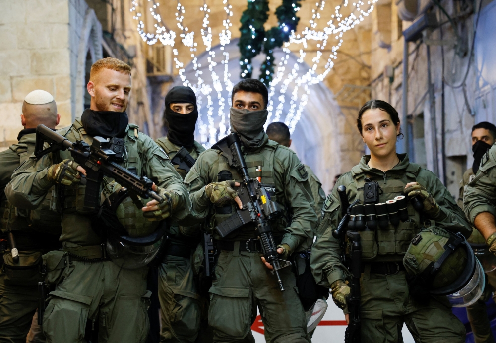 Israel has set up hundreds of volunteer security squads in the two weeks since the Hamas war erupted and is arming them should there be knock-on Jewish-Arab unrest, authorities said yesterday. — Reuters pic