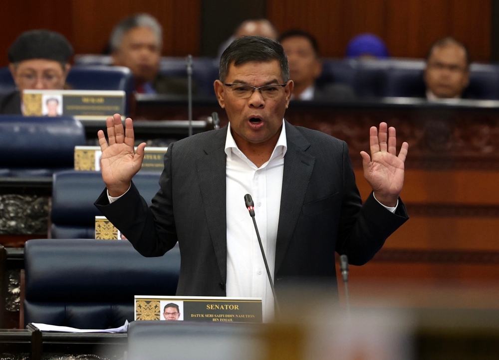 Home Minister Datuk Seri Saifuddin Nasution Ismail speaks at the Parliament in Kuala Lumpur October 23, 2023. — Bernama pic